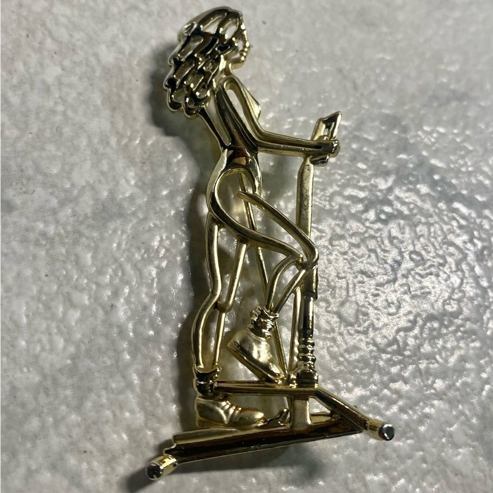 AJC Woman On Stair Machine Brooch